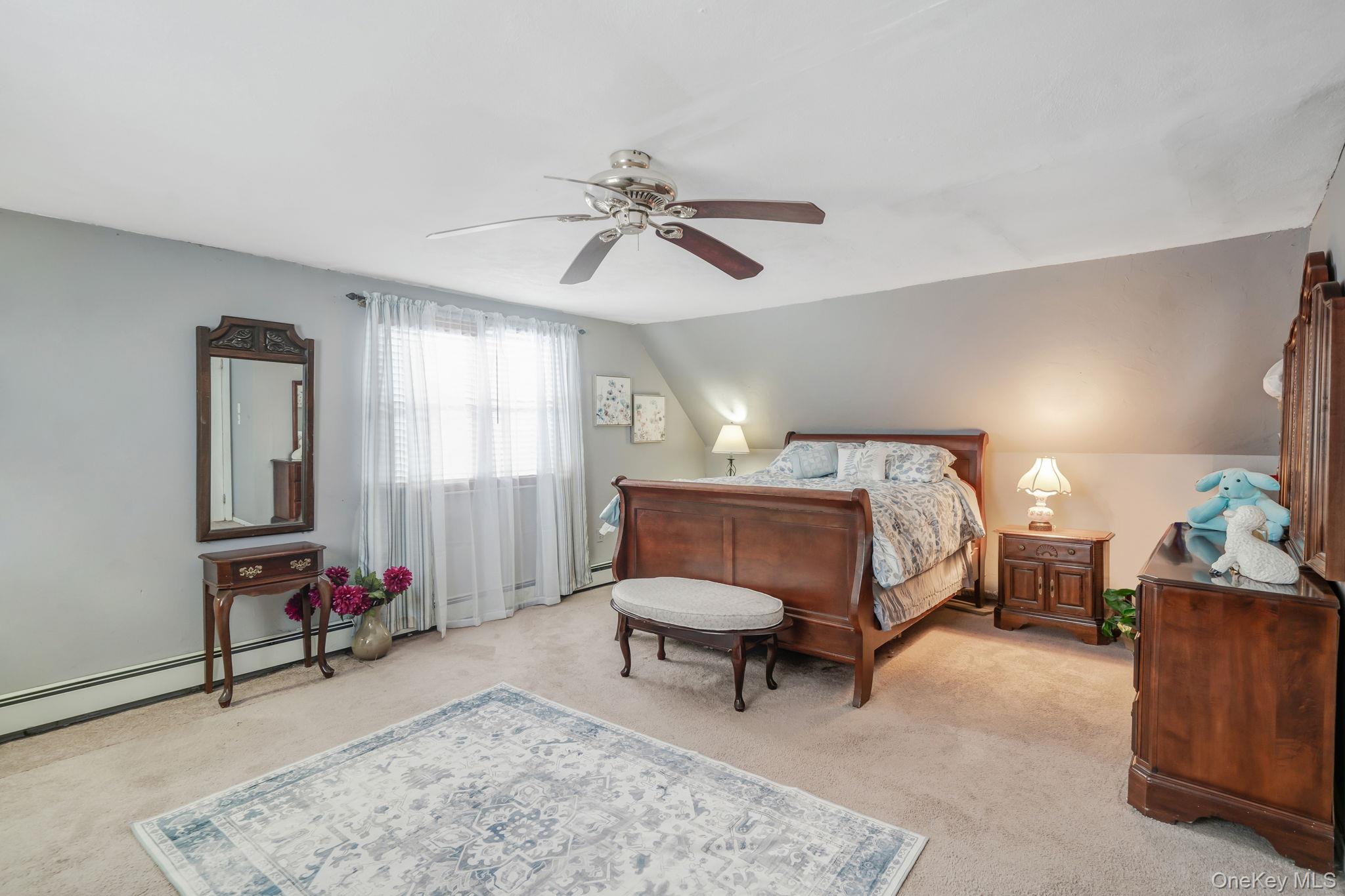 6 Howe Court Coram, NY 11727 - Photo 14 of 17 a bedroom with furniture and a rug