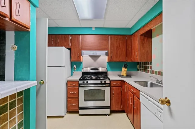 a kitchen with a stove and a microwave