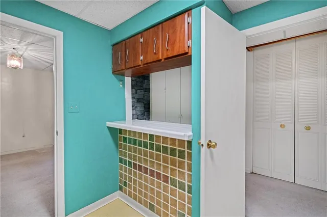 a view of front door with wooden floor