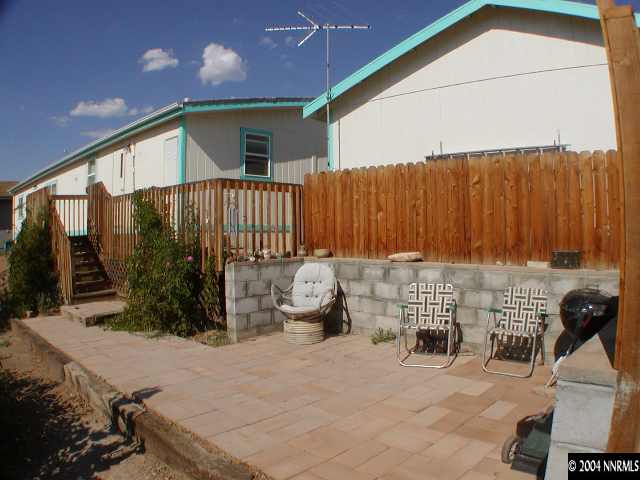 15205 Westwind Circle Reno, NV 89521 - Photo 3 of 6 a view of a chair and tables in the patio