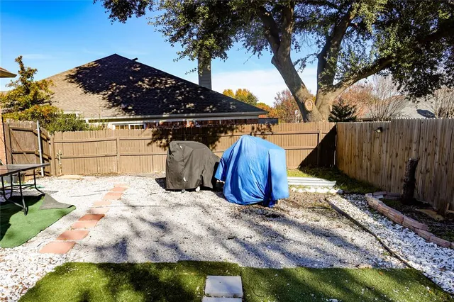 a view of a backyard of the house