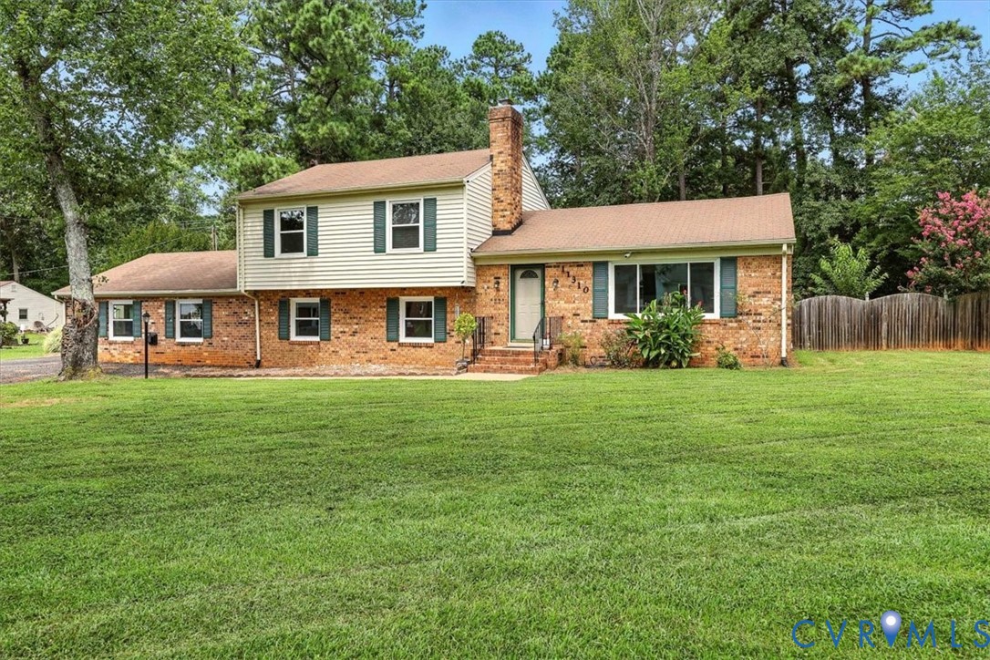 a front view of a house with garden and porch
