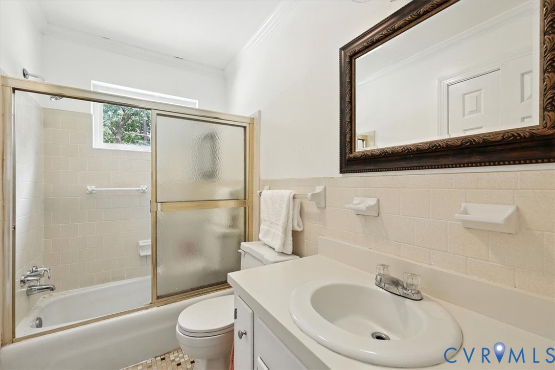 11310 Celtic Road Chesterfield, VA 23838 - Photo 15 of 21 a bathroom with a sink a toilet and a mirror