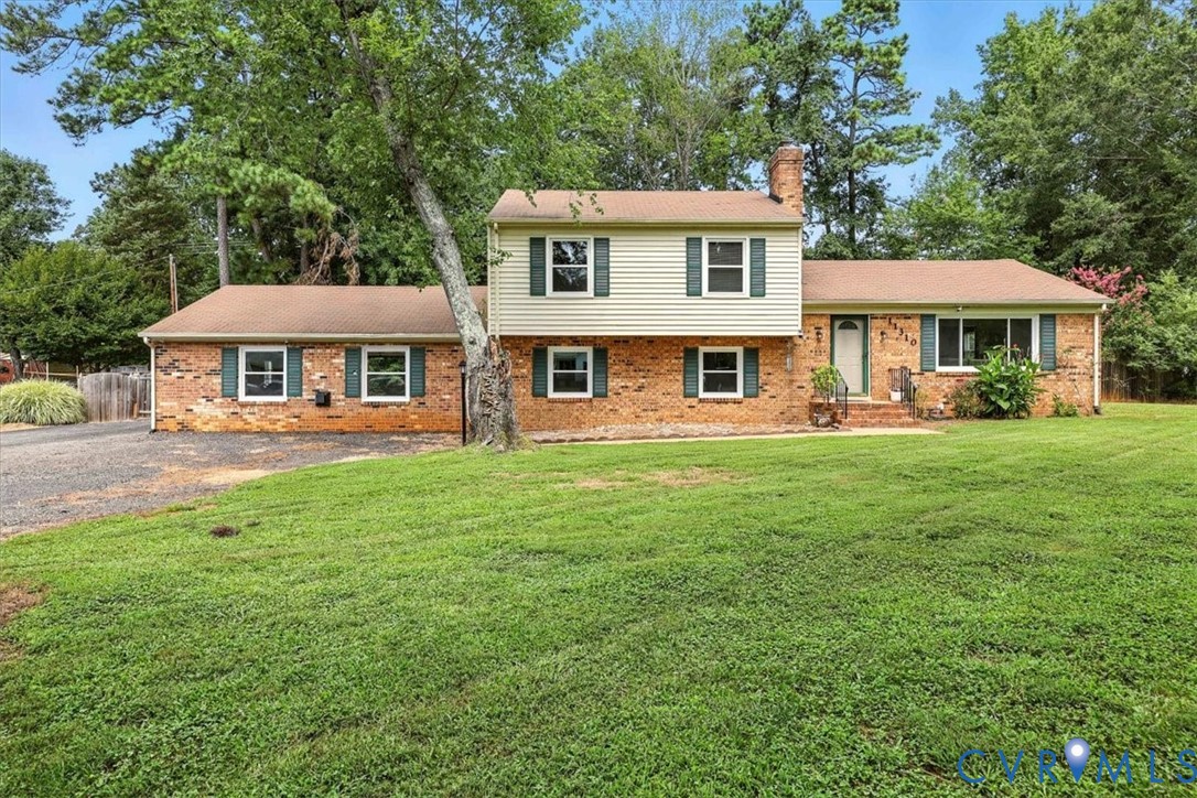 11310 Celtic Road Chesterfield, VA 23838 - Photo 2 of 21 a front view of a house with garden