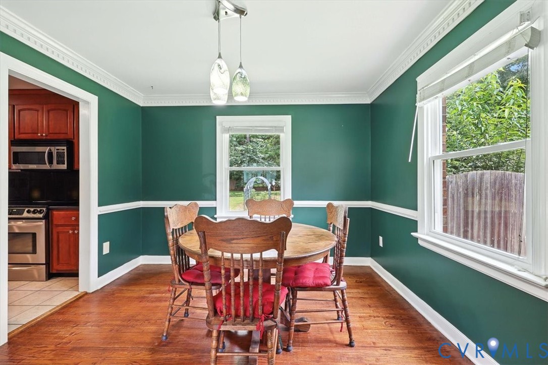 11310 Celtic Road Chesterfield, VA 23838 - Photo 9 of 21 a view of a dining room with furniture window and wooden floor