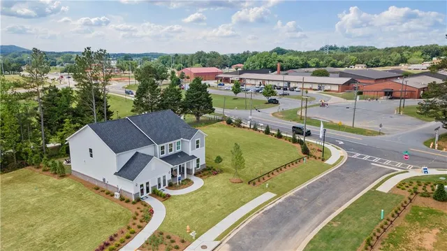 an aerial view of a house with a big yard