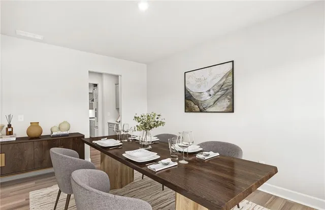 a view of a dining room with furniture
