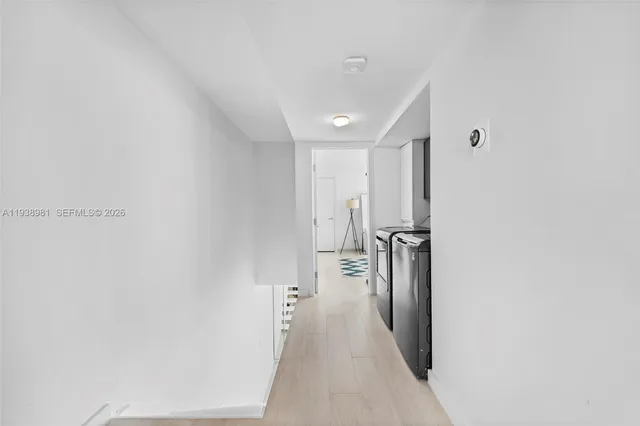 a spacious bedroom with a bed and a window