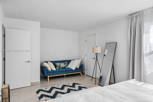 a bedroom with a bed and a table