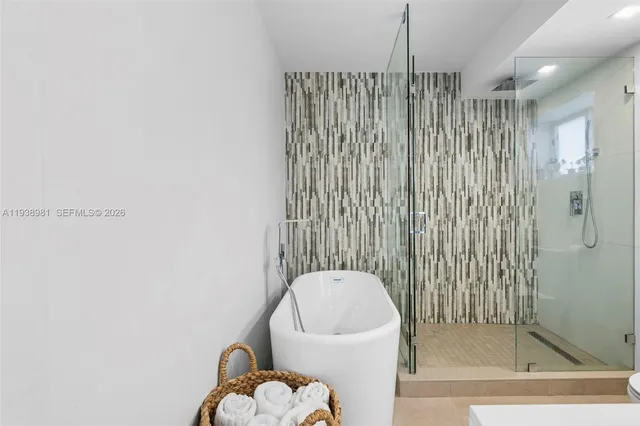 a bathroom with a toilet and a bathtub