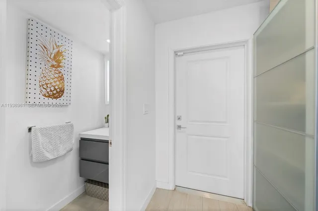 a bathroom with a shower and a sink