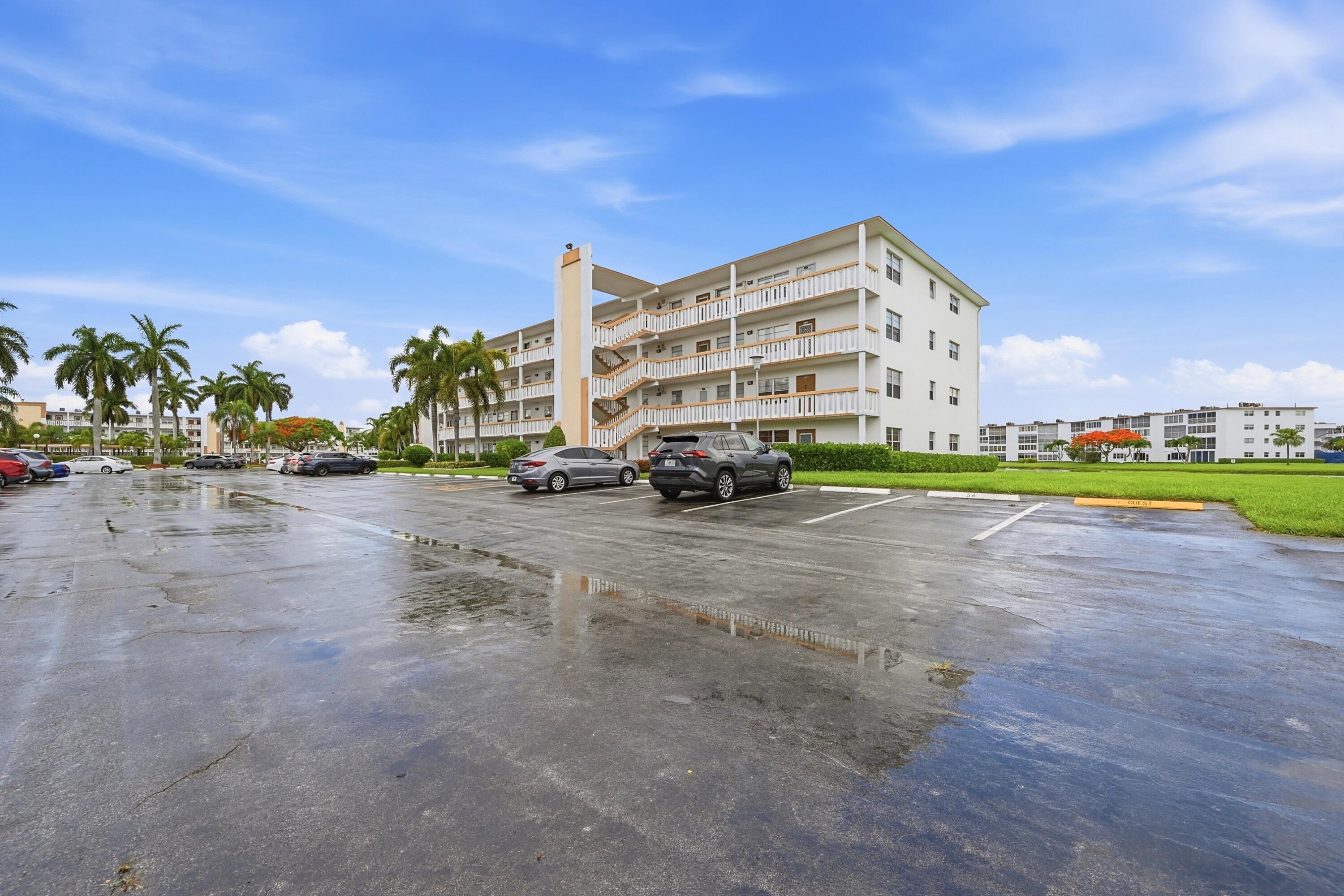 1043 Cornwall C Boca Raton, FL 33434 - Photo 6 of 34 a view of street with cars