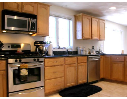 6 Arcadia Road Billerica, MA 01821 - Photo 8 of 10 a kitchen with stainless steel appliances granite countertop white cabinets granite counter tops and a window