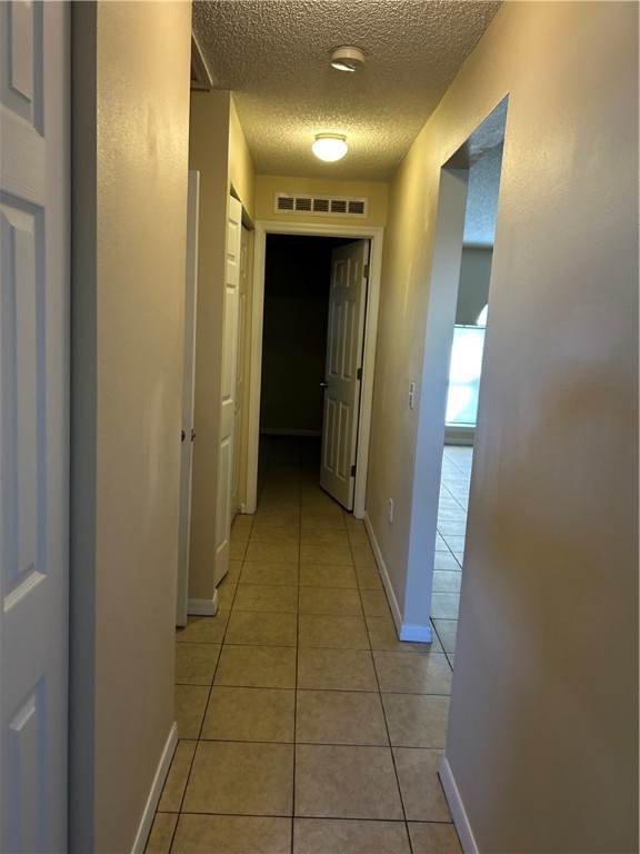 675 Forster Avenue Sebastian, FL 32958 - Photo 12 of 15 a view of a hallway with a glass door and a bathroom space