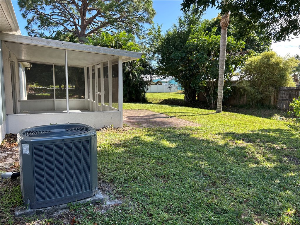 675 Forster Avenue Sebastian, FL 32958 - Photo 4 of 15 a view of a house with backyard and tree