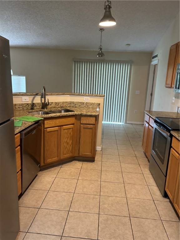 675 Forster Avenue Sebastian, FL 32958 - Photo 8 of 15 a kitchen with stainless steel appliances granite countertop a stove top oven cabinets a sink and a counter top space