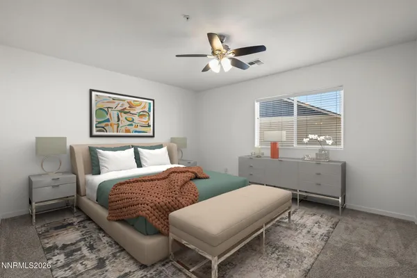 a bedroom with bed and window