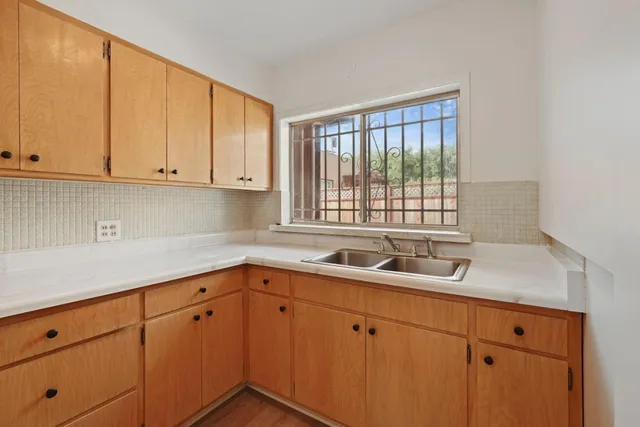 a kitchen with a sink and cabinets