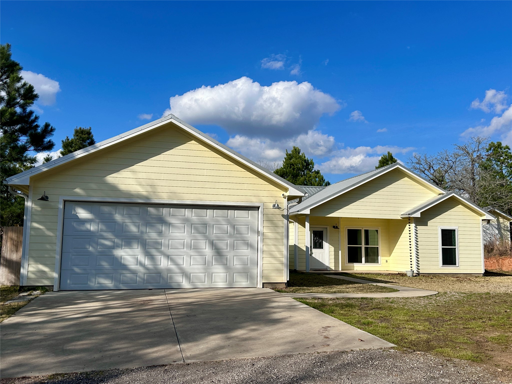 124 Pine Path Bastrop, TX 78602 - Photo 1 of 31 Farmhouse-style home with an oversized double car garage
