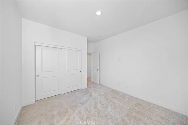 a bathroom with a shower sink and mirror