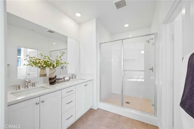 a bathroom with a toilet a sink and a mirror