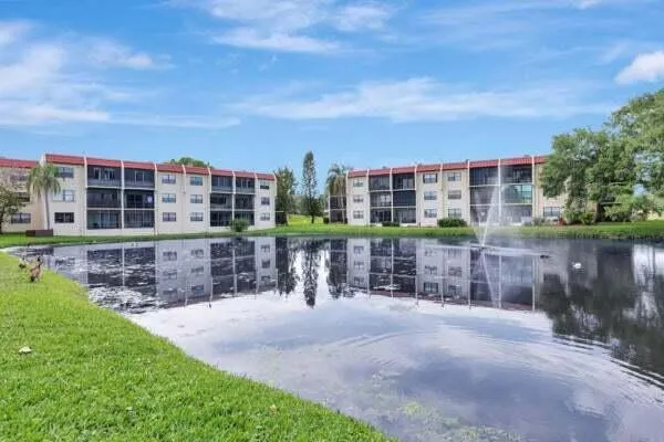 a view of building with a garden