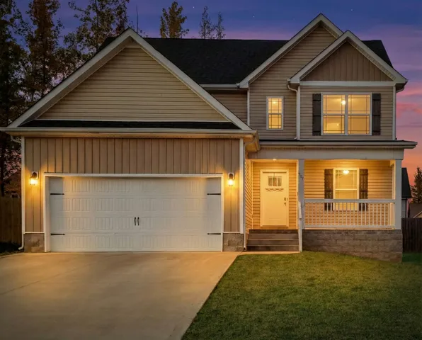 a front view of a house with a yard