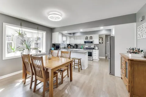a dining room with furniture and window
