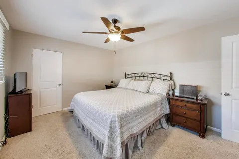 a bedroom with a bed and window