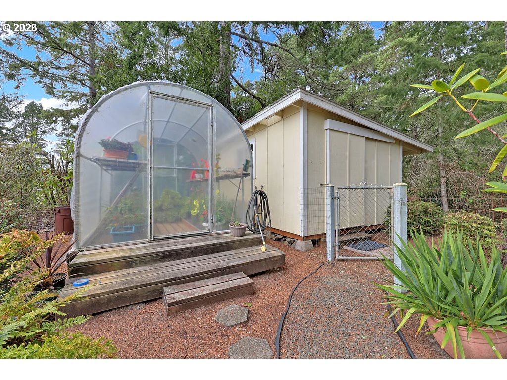 1415 20th Street Florence, OR 97439 - Photo 38 of 40 a backyard of a house with table and chairs