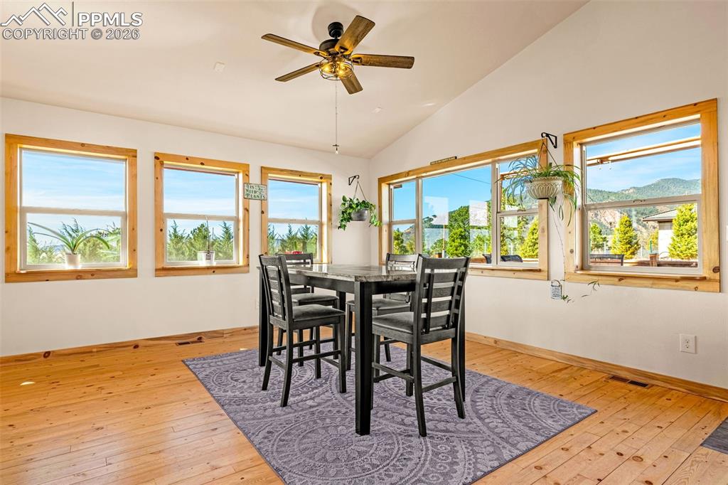 8480 Delaware Road Colorado Springs, CO 80926 - Photo 9 of 49 Dining area with lots of windows and natural light with walk-out to back patio