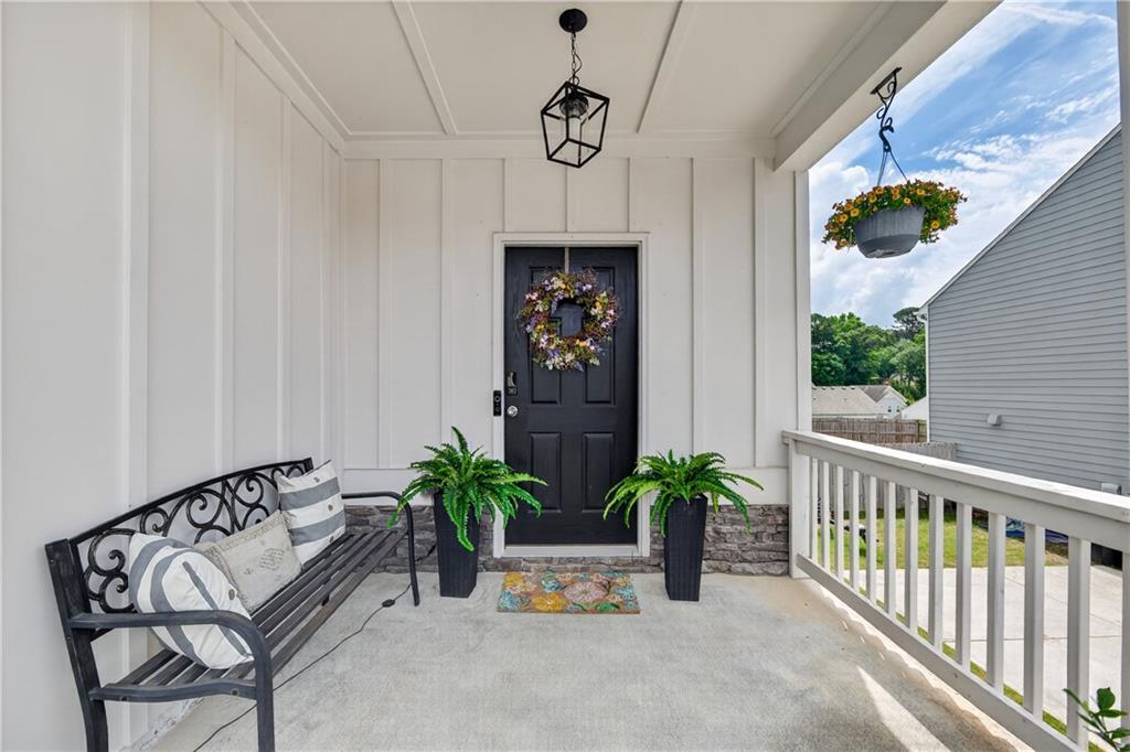 266 Shoals Bridge Road Acworth, GA 30102 - Photo 5 of 43 a view of a entryway door with flower pot