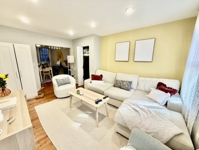 14 Cleveland Place, Unit 3 Boston, MA 02113 - Photo 18 of 22 a living room with furniture and a flat screen tv
