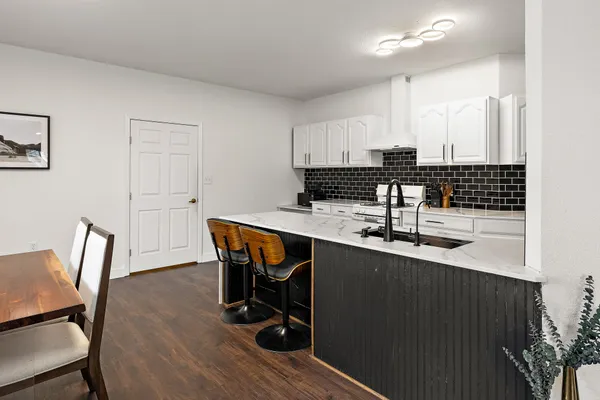 a room with table chair and wooden floor