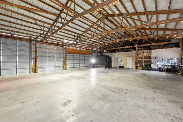 a view of empty room with wooden ceiling