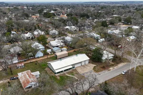 an aerial view of residential house with outdoor space