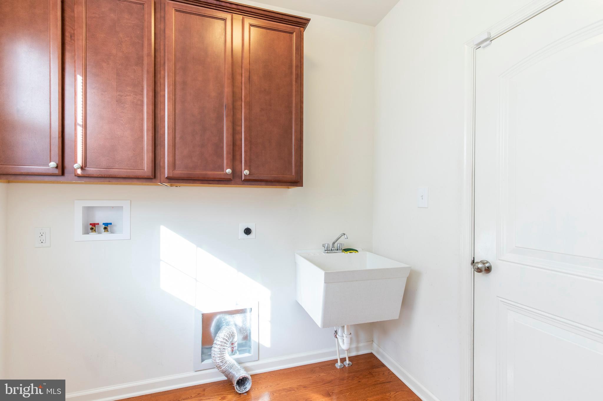 428 Welsh Hill Road Newark, DE 19702 - Photo 21 of 31 First Floor Laundry With Cabinets & Laundry Tub