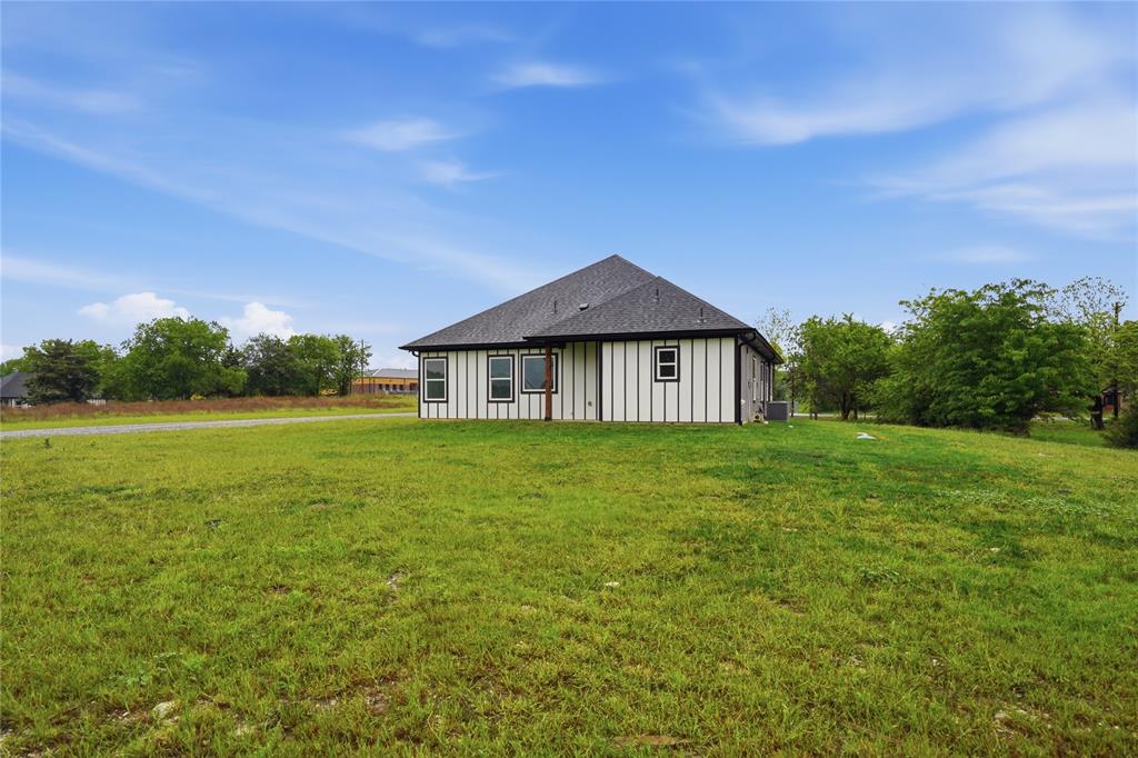 420 Ball Street Tom Bean, TX 75491 - Photo 30 of 34 a front view of a house with garden