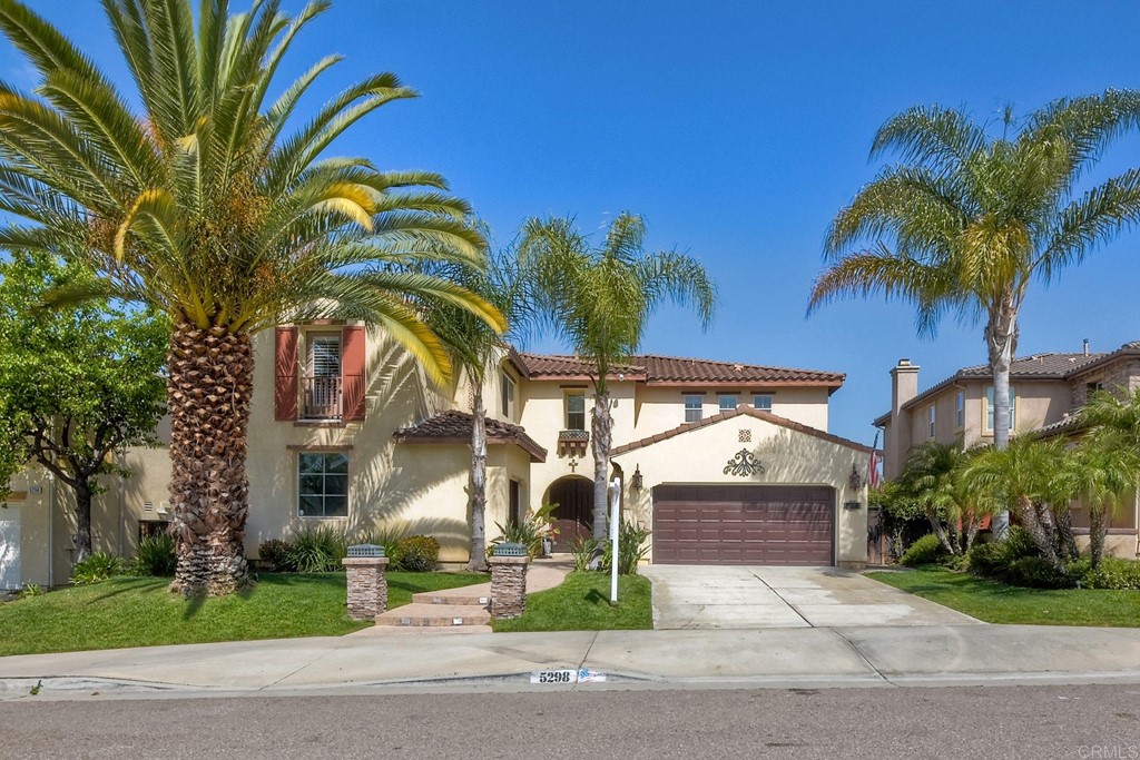 5298 Willow Walk Road Oceanside, CA 92057 - Photo 1 of 1 a view of multi story residential apartment building with a yard and entertaining space