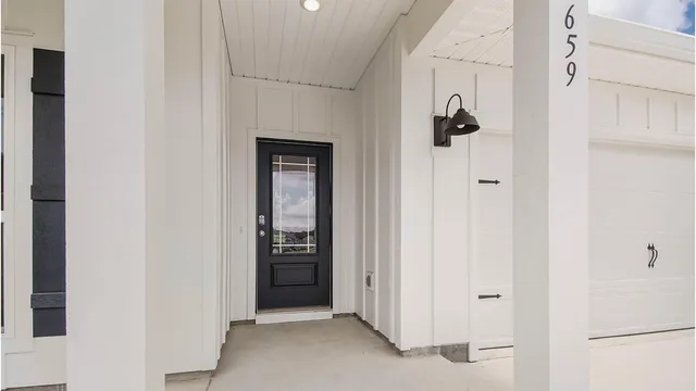 a view of a hallway with closet and entryway