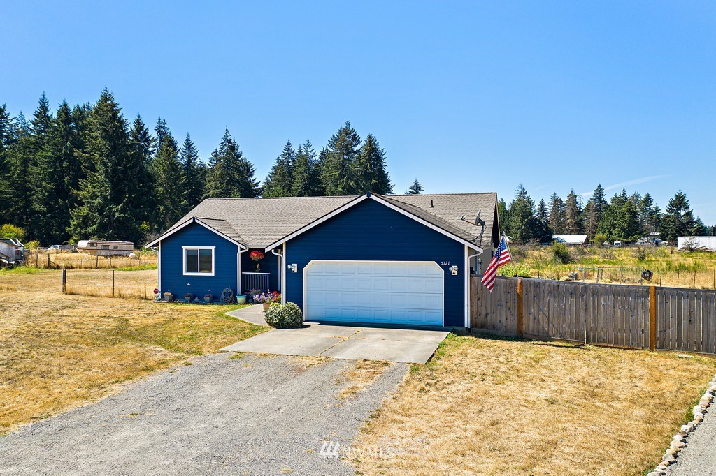5121 183rd Lane Southwest Rochester, WA 98579 - Photo 2 of 31 a view of a house with a yard