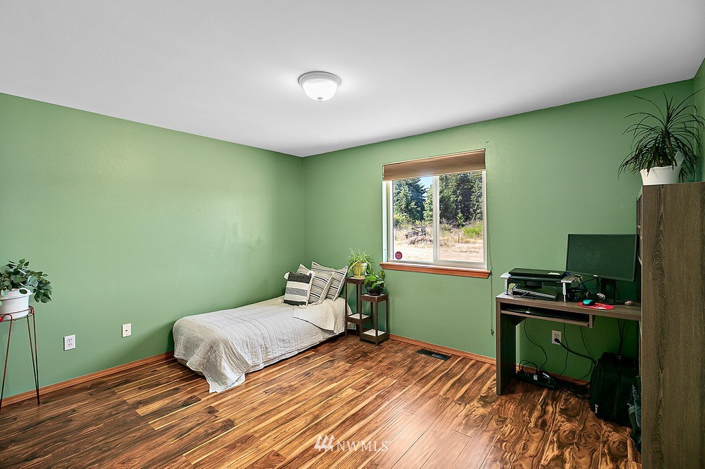5121 183rd Lane Southwest Rochester, WA 98579 - Photo 11 of 31 a bedroom with a bed and a window
