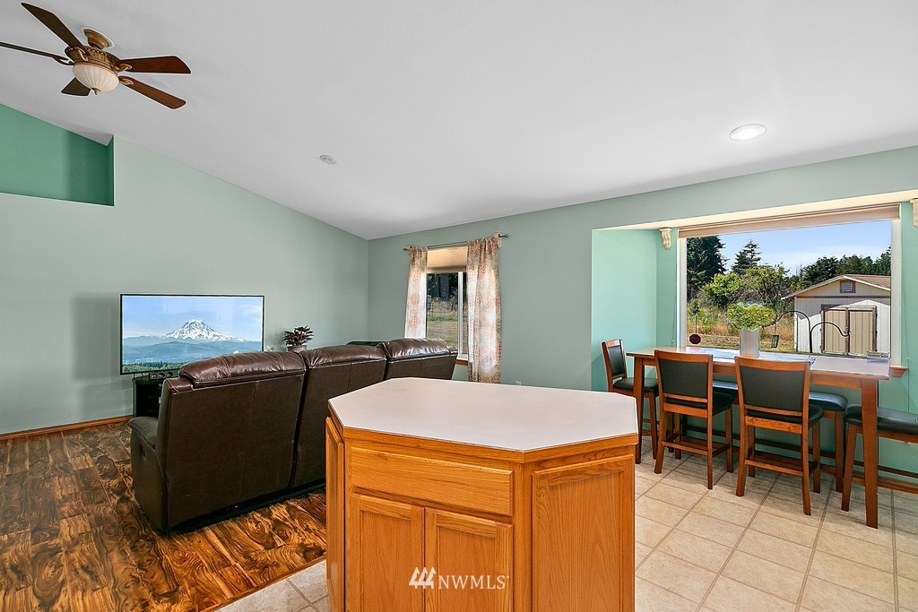 5121 183rd Lane Southwest Rochester, WA 98579 - Photo 17 of 31 a view of a dining room with furniture and chandelier
