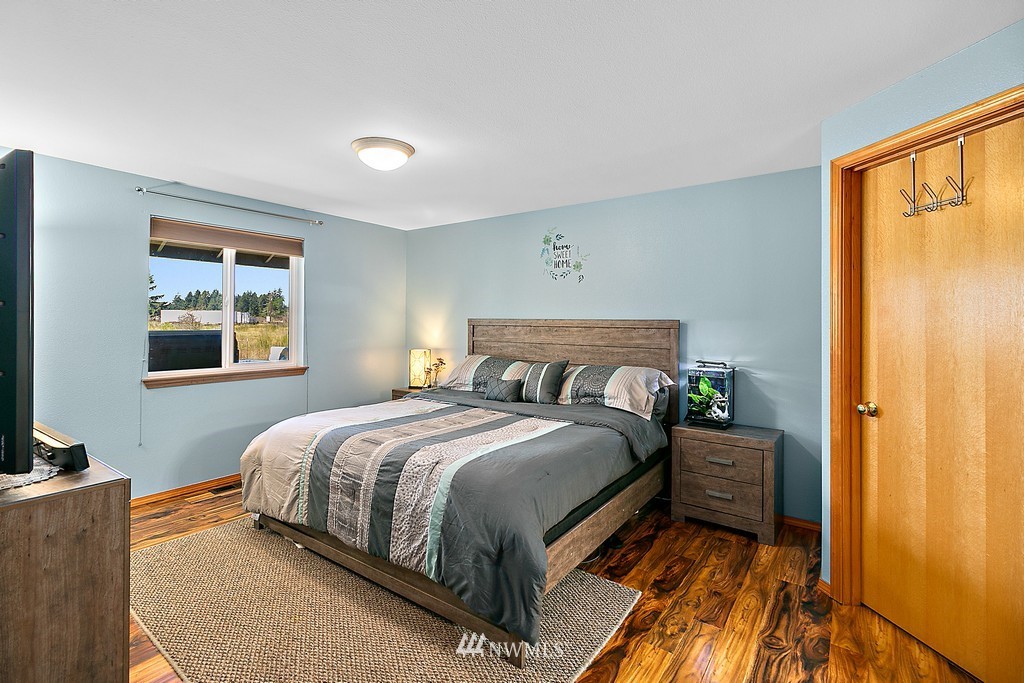 5121 183rd Lane Southwest Rochester, WA 98579 - Photo 19 of 31 a bedroom with a bed and a window