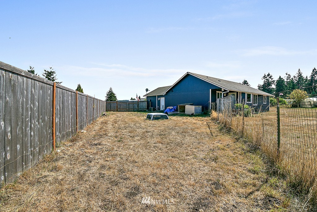 5121 183rd Lane Southwest Rochester, WA 98579 - Photo 22 of 31 a view of a house with wooden fence