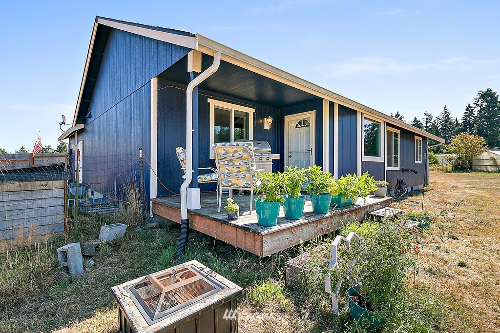 5121 183rd Lane Southwest Rochester, WA 98579 - Photo 23 of 31 front view of a house with a yard