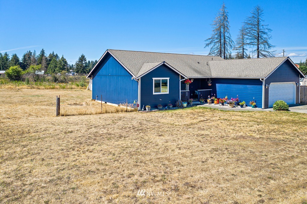 5121 183rd Lane Southwest Rochester, WA 98579 - Photo 27 of 31 a view of large house with a yard