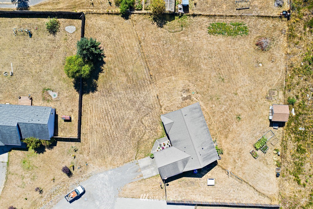 5121 183rd Lane Southwest Rochester, WA 98579 - Photo 28 of 31 wooden floor with a potted plant on the wall