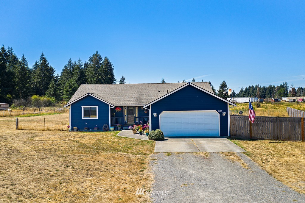 5121 183rd Lane Southwest Rochester, WA 98579 - Photo 30 of 31 a front view of a house with a yard