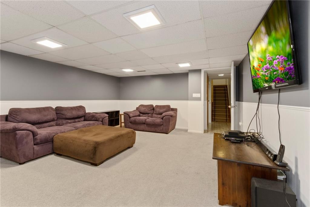 174 Cedar Ridge Drive Monaca, PA 15061 - Photo 11 of 22 A lower level game room offers an out of the way gathering option for a family looking for space to grow.